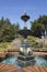 Water trickling over a fountain on a sunny day at Shore Acres State Park, Oregon