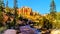 Water of the Tropic Ditch flowing through the vermilion colored Pinnacles and Hoodoos at the Mossy Cave trail in Bryce Canyon