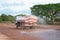 Water truck sprays water for a new road construction site