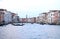 On the water view on a boat in one of the canals in in Venice Venezia Italy just before sunset.