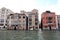 On the water view on a boat in one of the canals in in Venice Venezia Italy just before sunset.