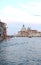 On the water view on a boat in one of the canals in in Venice Venezia Italy just before sunset.