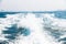 Water waves splash by speed boat daytime ocean sea travel closeup background city