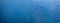 Water Waves Surface as Background. Light ripples in the water. Beautiful abstract banner in blue. Straight lines of waves along