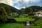 The water weir is surrounded by nature in rural Japan, on a cloudy day in the valley village of Fukushima, a concrete gutter slows