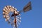 WATER WINDMILL PUMP WHEEL AGAINST BLUE SKY