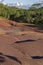 The water worn Dunes with a variety of oxide colours at the 7 Coloured Earths Visitor attraction in Mauritius.