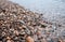 Water worn pebbles at the edge of a lake