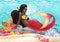 Watercolor african mermaid lies on the stone at the ocean sandy bottom among the coral reef plants and fish