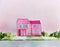 Watercolor of ai midjourney of a tiny pink house model