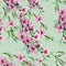 Watercolor branch peach on a lime green background. Seamless pattern.