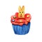 Watercolor Easter cupcake decorated with a rabbit biscuit.