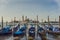 Watercolor effect of gondolas pier row anchored photo on Canal Grande with San Giorgio Maggiore church in the background, Venice,