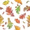 Watercolor hand drawn autumn oak and maple leaves and seeds seamless pattern in natural colors