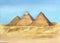 Watercolor hand drawn illustration of egyptian pyramids in Giza.