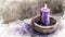 Watercolor illustration capturing the spirit of Ash Wednesday, featuring a purple candle beside an ash-filled bowl, calm