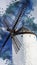 Watercolor illustration of a close up windmill. Artistic wallpaper, background or backdrop in white and blue colors