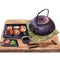 Watercolor illustration of a set of sushi on a plate, ginger, wasabi, soy sauce and a teapot on a bamboo mat and a