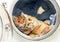 Watercolor illustration of two funny ginger cats lying comfortably in an open washing machine