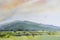 Watercolor landscape painting colorful of mountain range with farm cornfield