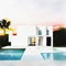 Watercolor of A large modern white House with pool sunset