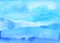 Watercolor light azure blue background painting. Watercolour calm blue stains on paper. Artistic liquid backdrop