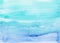 Watercolor light cyan blue background painting. Watercolour bright sky blue stains on paper. Watery texture, hand painted