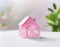 Watercolor of Miniature house coin bank on coloured Created withtechnology and
