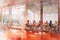 Watercolor modern painting: People are sitting at tables in cafe. Illumination by sunlight. AI