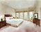 Watercolor of Neat bedroom with spacious bed and