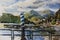 Watercolor original landscape with pier and boats docked at a marina on Lake Como in the harbor of the Como city, Northern Italy