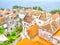 Watercolor painting of orange roofs Mediterranean coastal homes