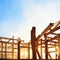 Watercolor of roofer working on roof structure at construction site