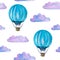 Watercolor seamless pattern with blue hot air balloons, clouds and airship isolated on white