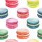 Watercolor seamless pattern of bright colorful macaroons on white background. Hand drawn festive backdrop. Isolated almond cookies