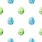 Watercolor seamless pattern with colored quail eggs