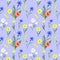 Watercolor seamless pattern of meadow flowers on a blue background.