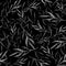 Watercolor seamless pattern with monochrome leaves and branches on a black background