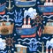 Watercolor seamless pattern with ships, steering wheels and sea waves on navy blue