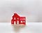 Watercolor of Small red decorative house on a white