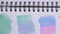 watercolor stains, fills and blots in a notebook close-up.