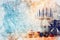 watercolor style and abstract image of jewish holiday Hanukkah with menorah