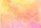 Watercolor vivid yellow, orange, pink background texture. Peach color stains on paper