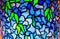 Watercolour painting of blue stained glass mosaic background.