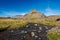 Watercourse coming from the Snaefellsjokull glacier near the village of Arnarstapi on a cool summer day