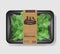 Watercress salad leaves with plastic tray container with cellophane cover. Retro design. Mockup template for your salad