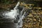 Waterfall on the Abava River, autumn in Latvia