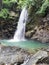 Waterfall of Abgbalala Falls in tropical rain forest in Mindoro