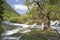 Waterfall across mountain background