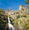 Waterfall & ancient stone tower at Castifao in Corsica